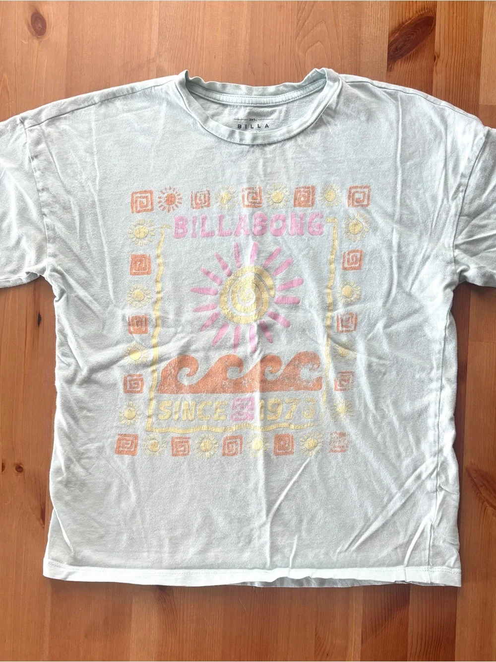 Girls Billabong Pastel Graphic Tee in Light Blue with Pink Sun & Orange Waves